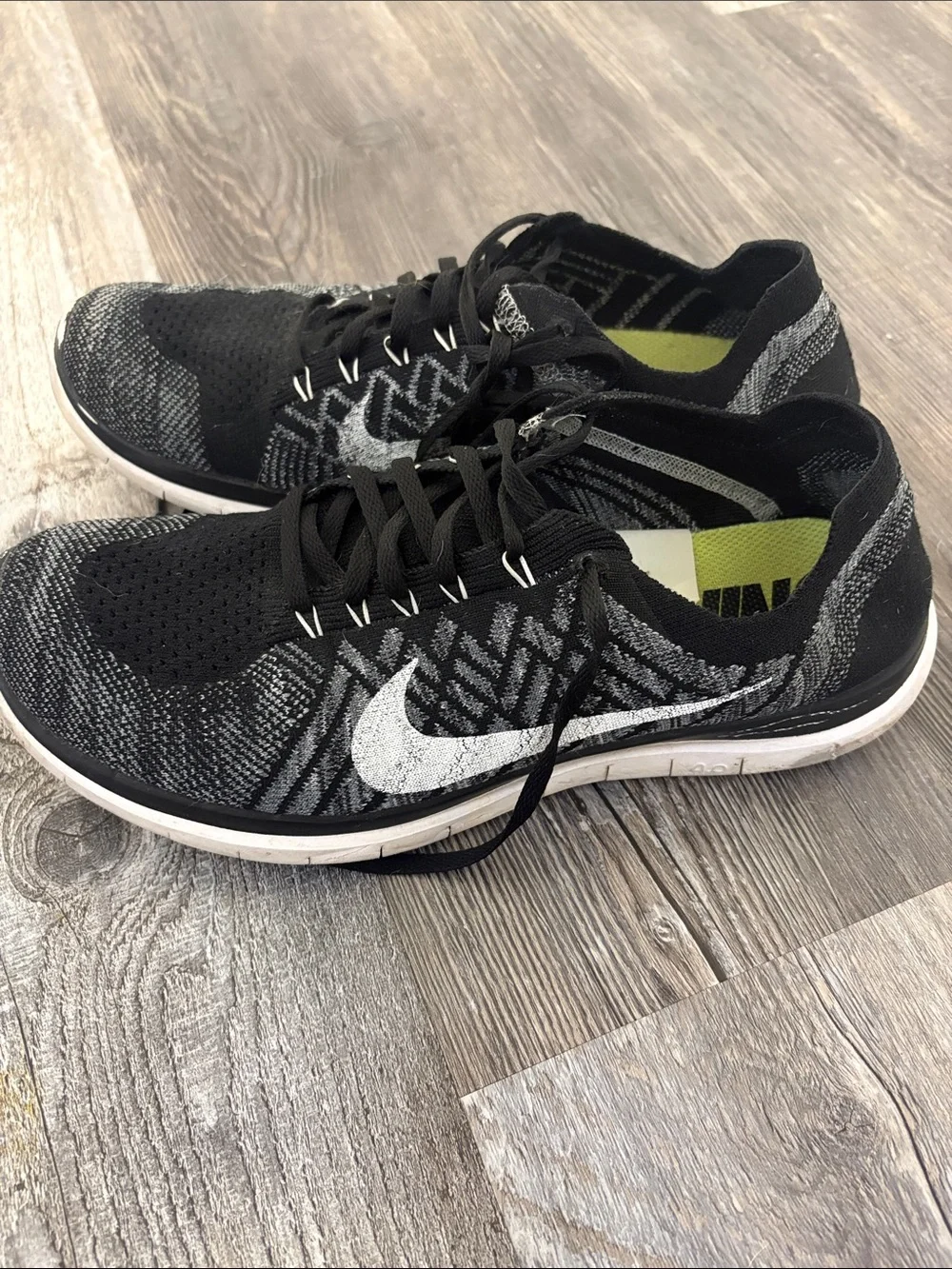 Nike Men’s Black and White Flyknit Athletic Sneakers